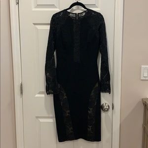 Black long sleeve dress with lace sleeves.